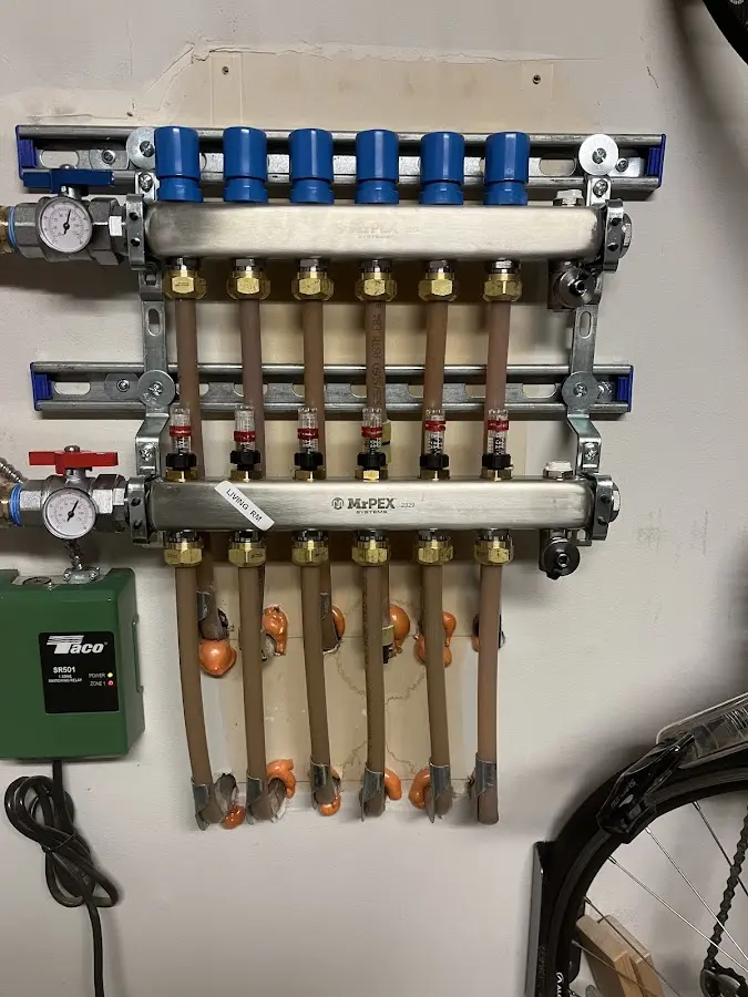 Plumber performing Water Heater Repair at a residential property in Peabody